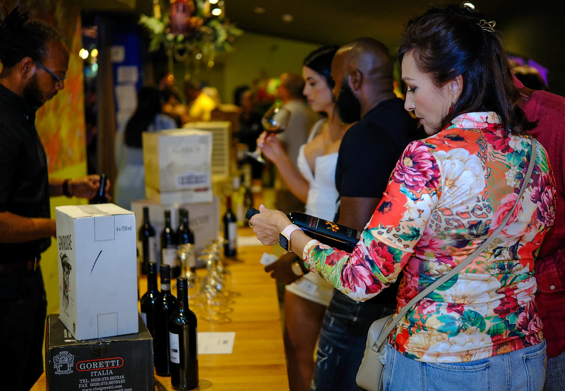 Guests exploring wines at a tasting table